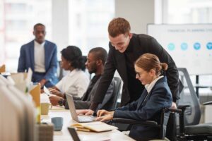 Businesswoman reviewing data with a colleague in an office setting